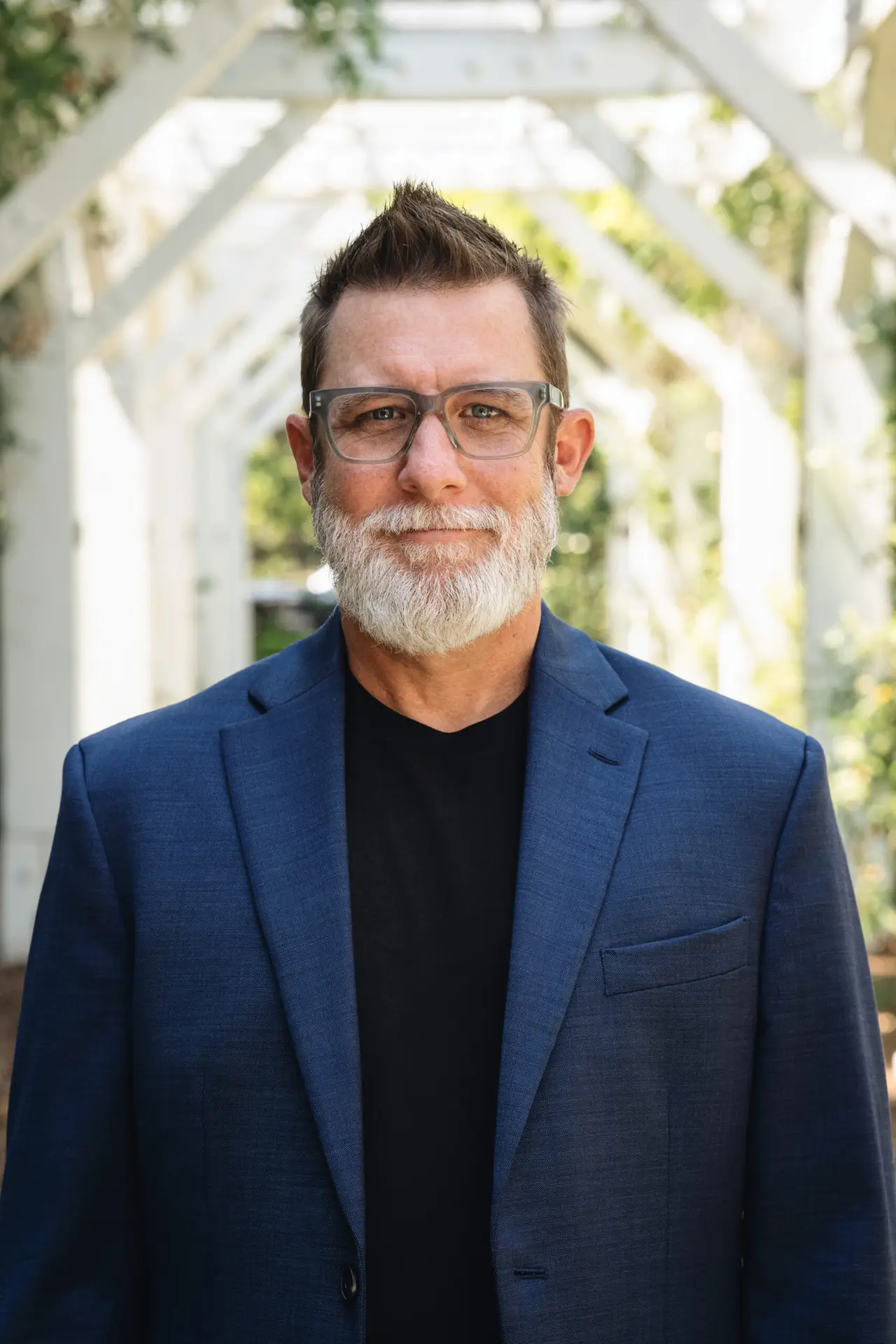 Professional portrait of Adrian Crandall, Senior Sales Executive with Corinthian Title Company, providing real estate fraud prevention guidance.